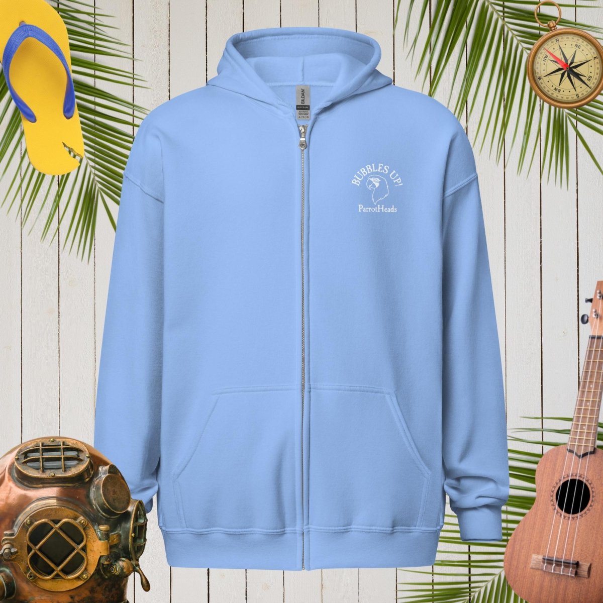 Light blue ParrotHead Hoodie with a logo on a wooden background with tropical elements.