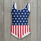 USA Flag One-piece swimsuit with American flag design on a rustic wood background