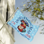 Flag with a parrot design and text about American Parachute's 250 years of freedom, displayed outdoors.