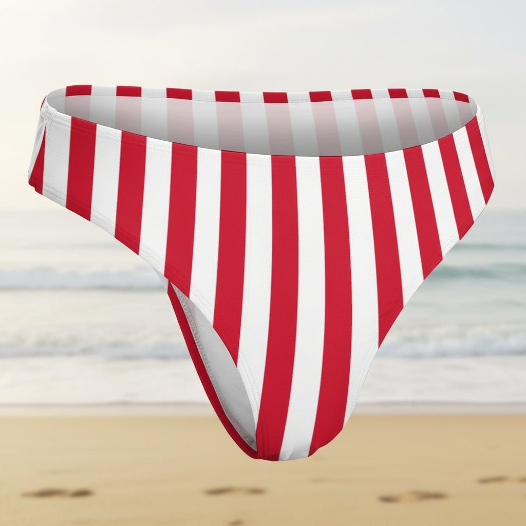 Red and white striped bikini bottom on a faded beach background