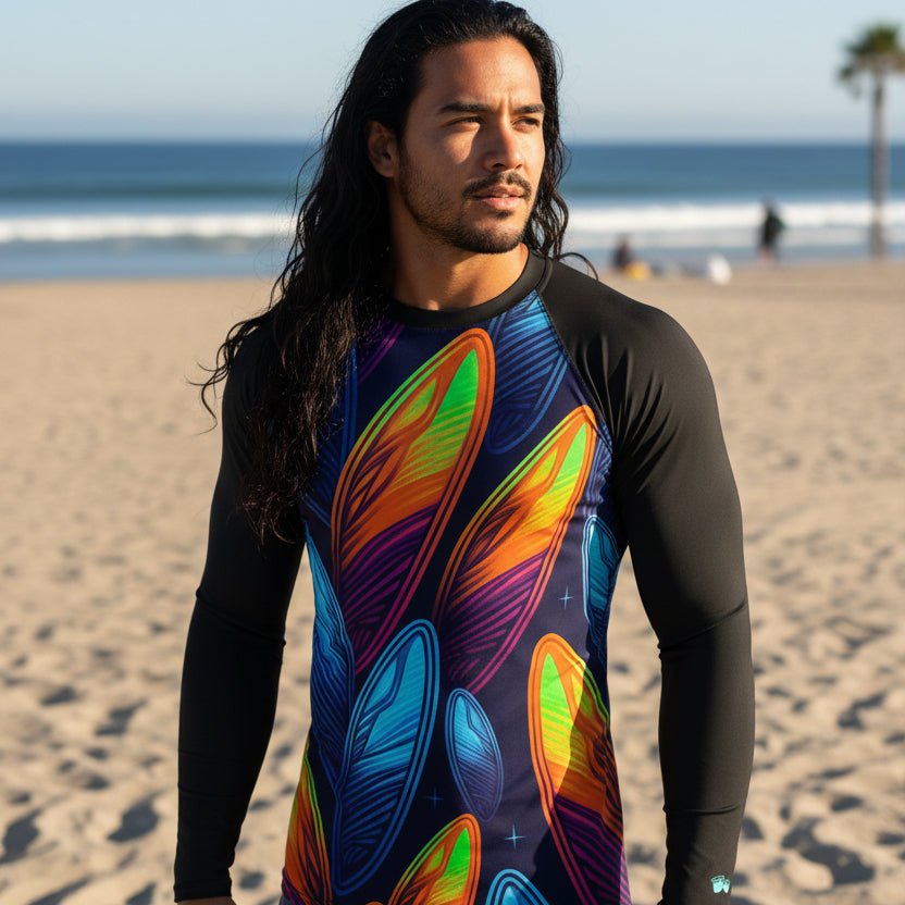 Surfer wearing a black long-sleeve Rash Guard with colorful abstract surfboard designs on venice beach
