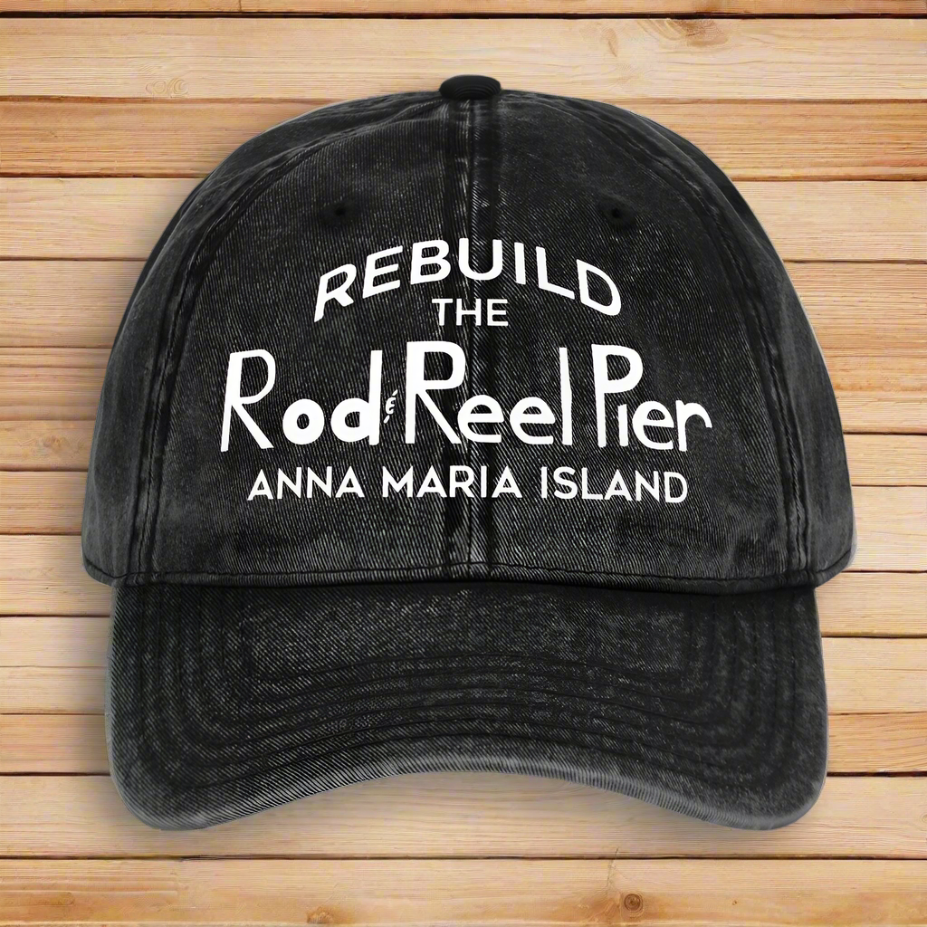 Black cap with white text 'REBUILD THE Rod Reel Pier Anna Maria Island' on a white background