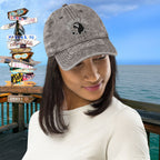Woman wearing a cap with a scenic background of a pier with directional signs in Key West.