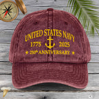 Maroon cap with yellow 'United States Navy 1775-2025 250th Anniversary' text on a wooden background