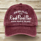 Maroon cap with white text on a wooden surface