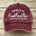 Maroon cap with white text on a nautical wood background