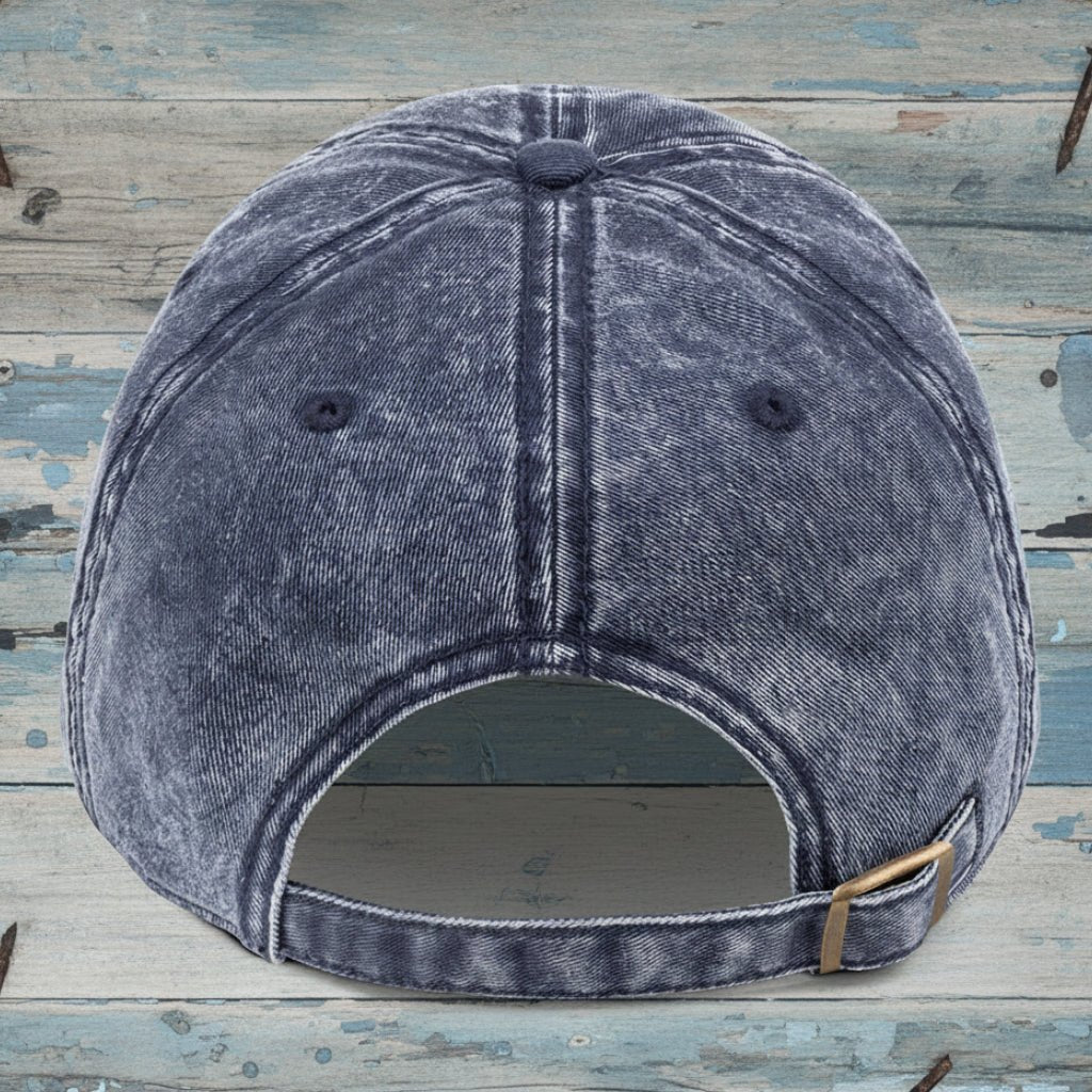 Blue denim cap on a wooden surface