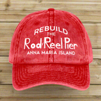 Red cap with white text 'Rebuild the Rod Reel Pier Anna Maria Island' on a white background
