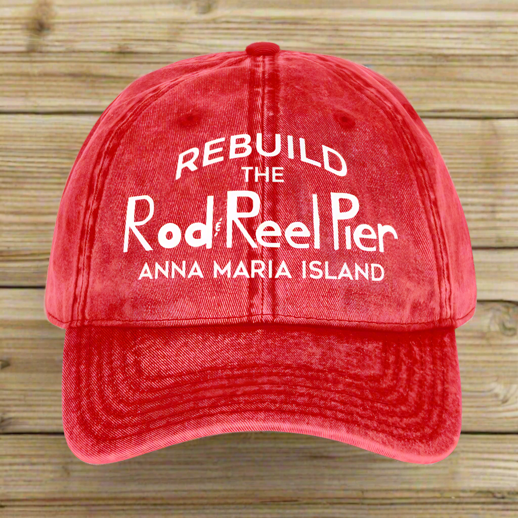 Red cap with white text 'Rebuild the Rod Reel Pier Anna Maria Island' on a white background