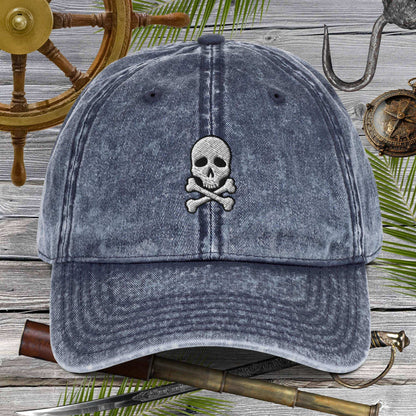 Skull And Crossbones Vintage Cotton Twill Cap with embroidered design on distressed fabric.