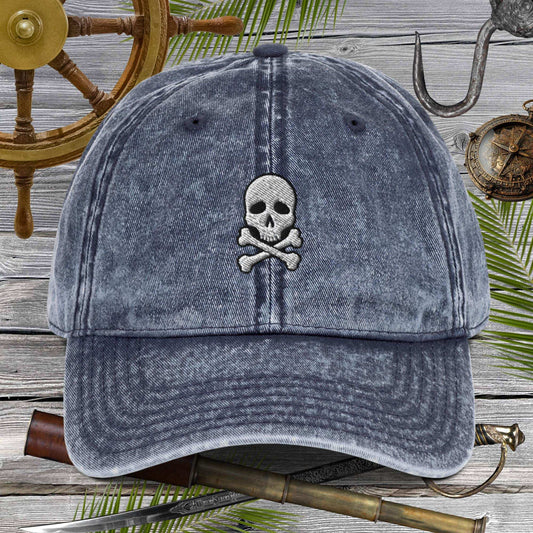 Skull And Crossbones Vintage Cotton Twill Cap with embroidered design on distressed fabric.