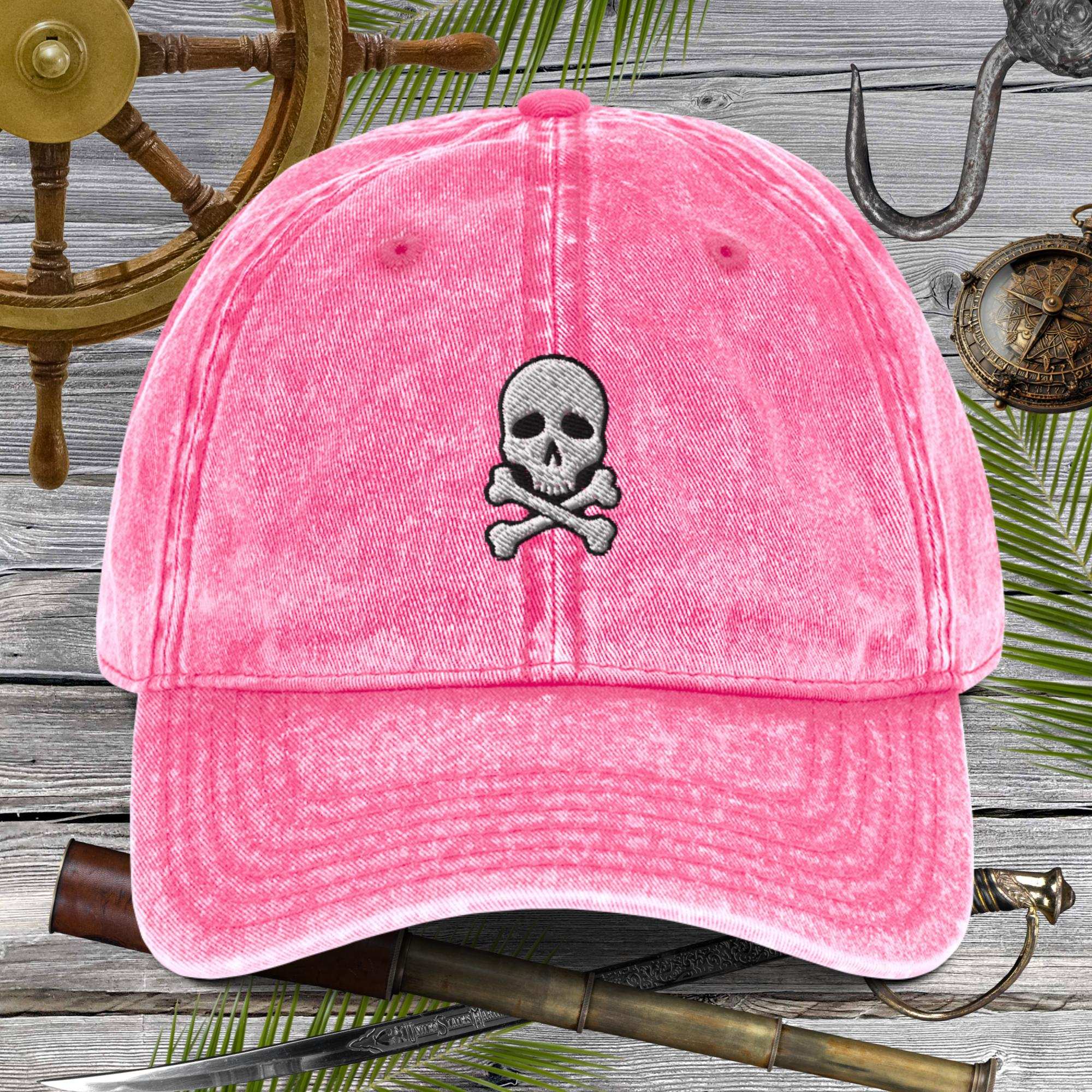 Skull And Crossbones Vintage Cotton Twill Cap in pink with embroidered skull design.
