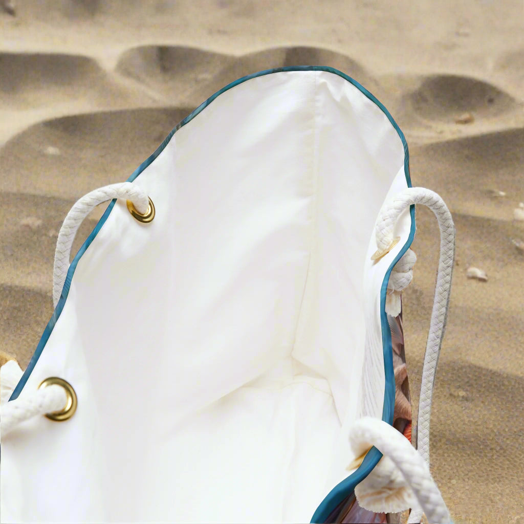 Weekender Shellers Bag sitting in the sand