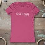 Pink t-shirt with 'Sea Vixen salty af' text on a rustic nautical wood background