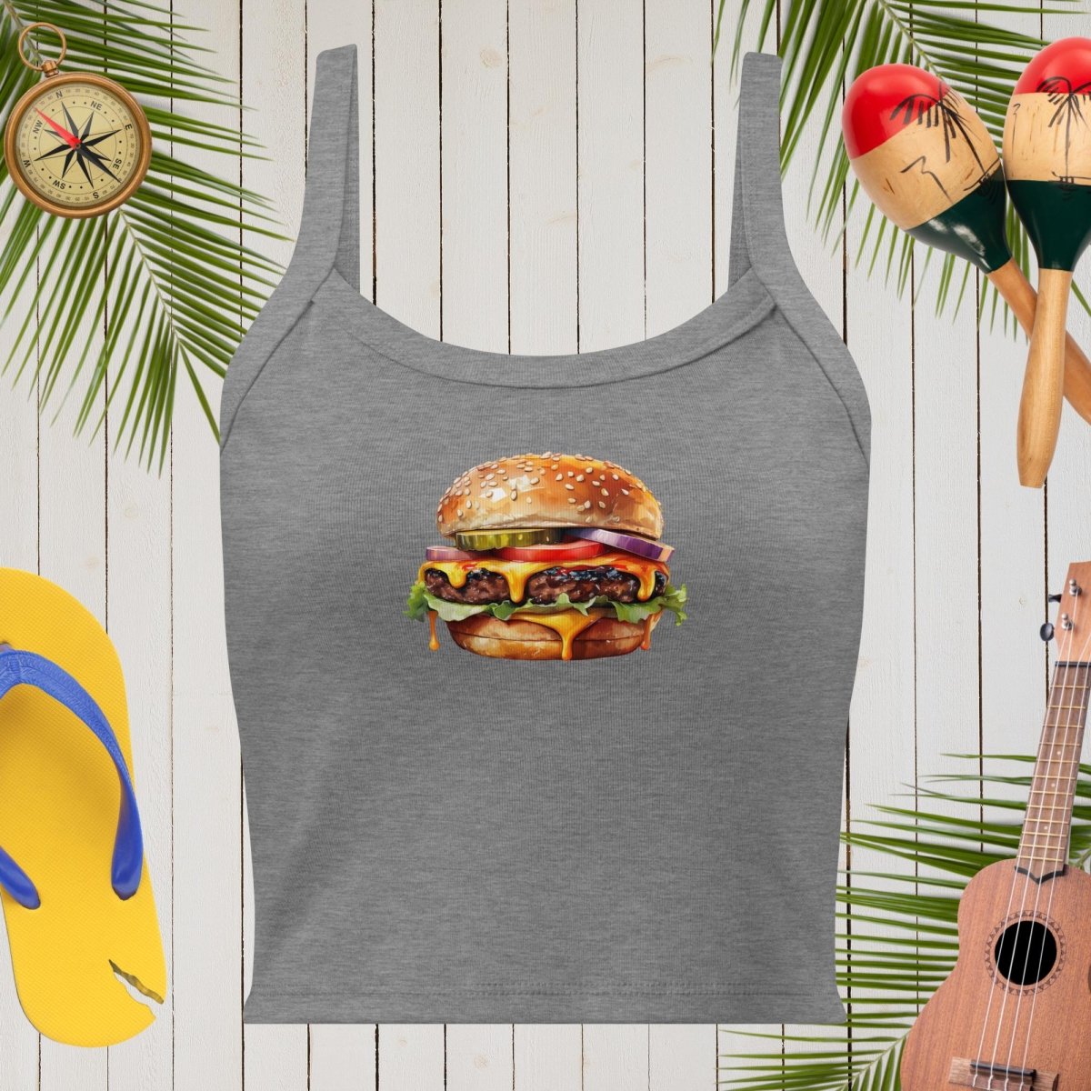Gray Womens Tank-Top top with a hamburger graphic on a wooden background with maracas, flip-flops, and a ukulele.