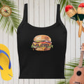 Black tank top with a hamburger graphic on a wooden background with tropical elements.