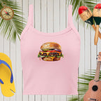 Pink tank top with a hamburger graphic on a wooden background with tropical elements.