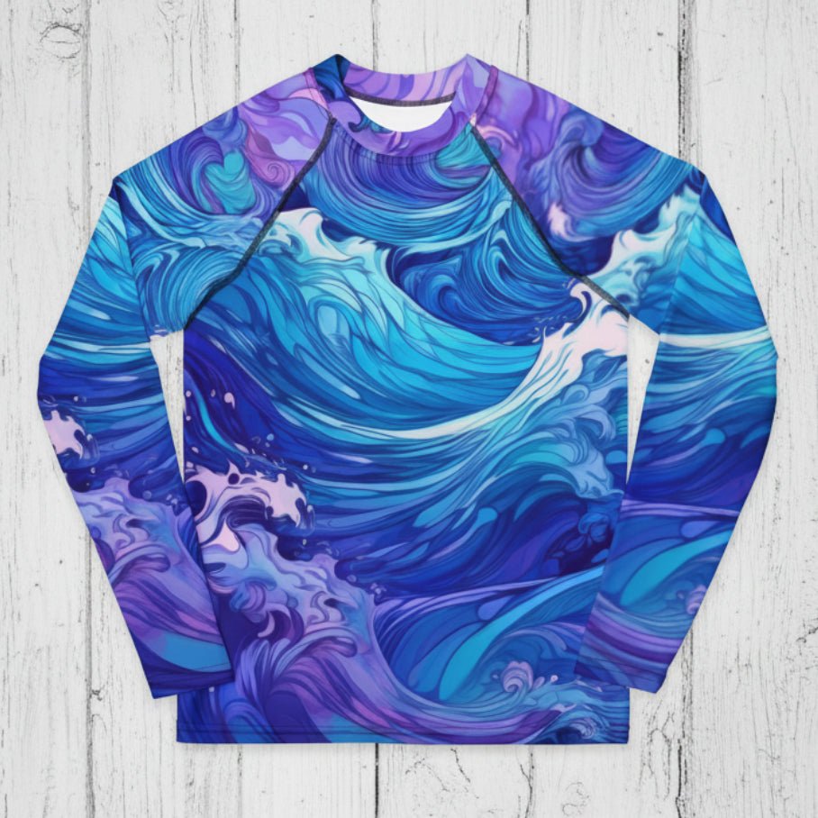 Long-sleeve shirt with blue and purple wave pattern on a rustic wood background