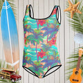Teen youth one piece swimsuit with Hawaiian style pattern floating in front of a rustic nautical wall adorned with a surfboard, a sand dollar, a starfish and a ukulele 